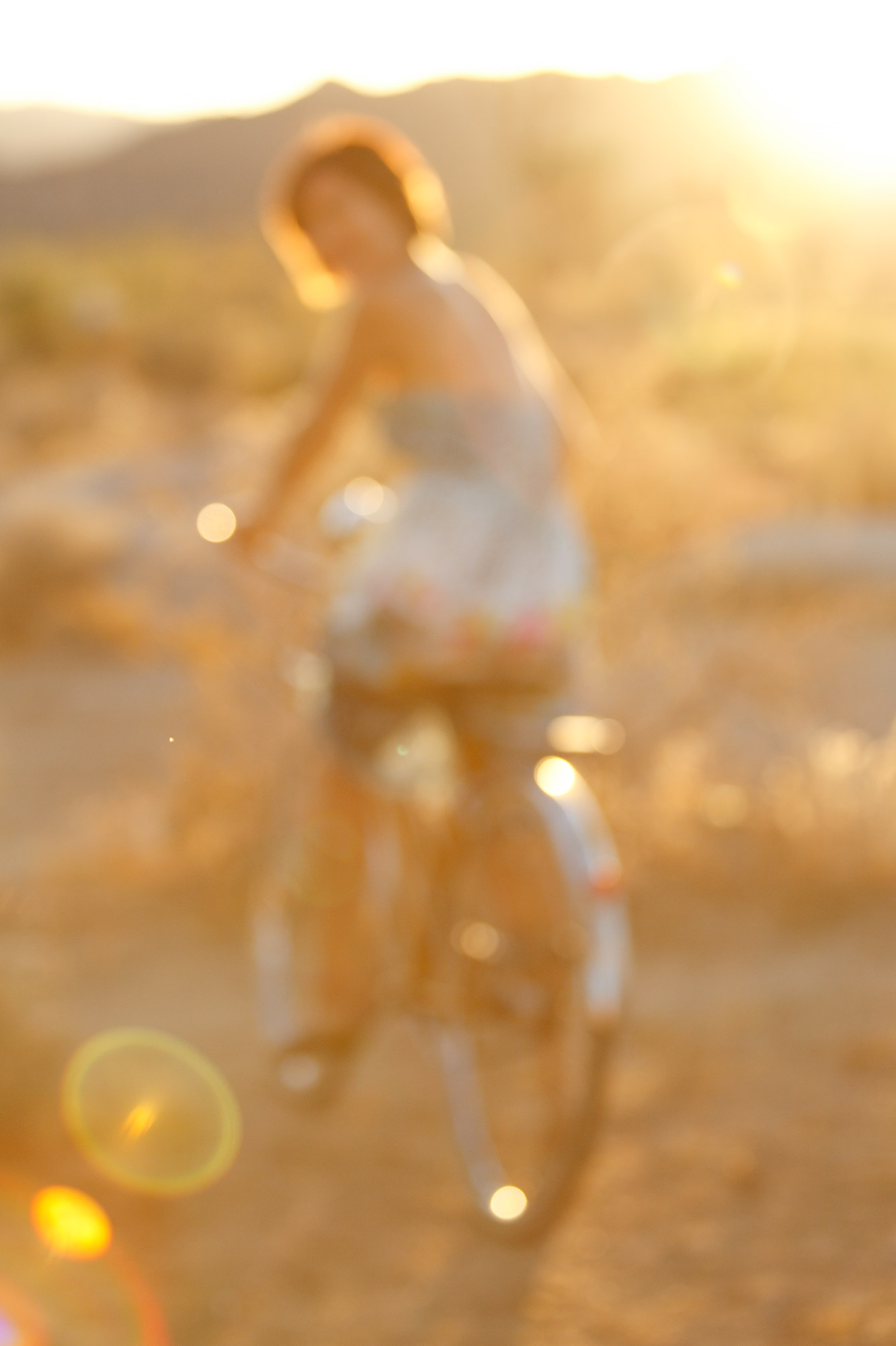 Lifestyle-025-woman-bike-desert-sunflare